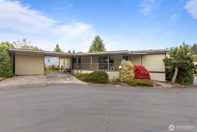 11436SE 208th St Unit 180, Kent, WA 98031 - view of front facade featuring an attached carport and driveway