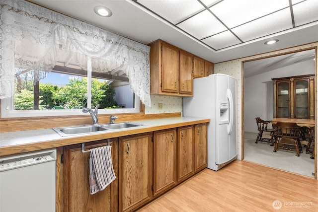 11436SE 208th St Unit 188, Kent, WA 98031 - kitchen featuring white appliances, brown cabinetry, light countertops, light wood-style floors, and recessed lighting
