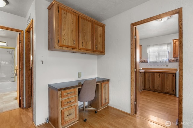 11436SE 208th St Unit 188, Kent, WA 98031 - home office featuring built in study area and light wood finished floors