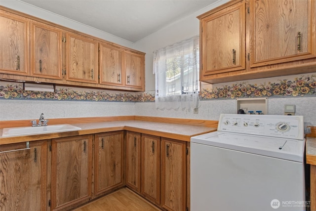 11436SE 208th St Unit 188, Kent, WA 98031 - laundry room with washer / dryer, cabinet space, and light wood-style floors
