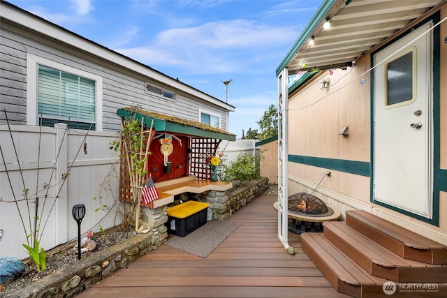 7704 Birch Bay Dr Unit 2805, Blaine, WA 98230 - wooden terrace featuring an outdoor fire pit and entry steps