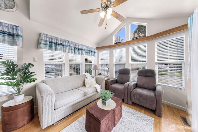 7704 Birch Bay Dr Unit 2805, Blaine, WA 98230 - living area with a ceiling fan, lofted ceiling, light wood finished floors, and baseboards