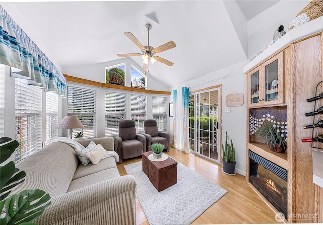 7704 Birch Bay Dr Unit 2805, Blaine, WA 98230 - living room with vaulted ceiling, a ceiling fan, light wood-style floors, and baseboards