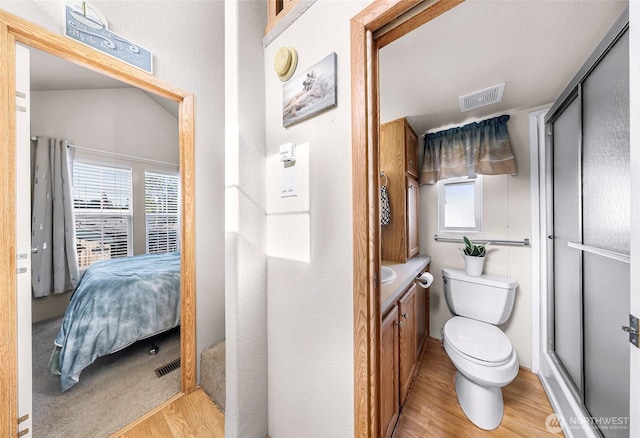 7704 Birch Bay Dr Unit 2805, Blaine, WA 98230 - bathroom featuring wood finished floors, vanity, toilet, and ensuite bath