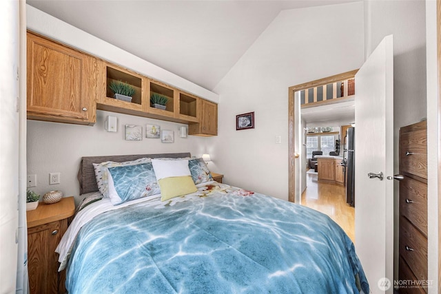 7704 Birch Bay Dr Unit 2805, Blaine, WA 98230 - bedroom with vaulted ceiling, light wood-style floors, and freestanding refrigerator