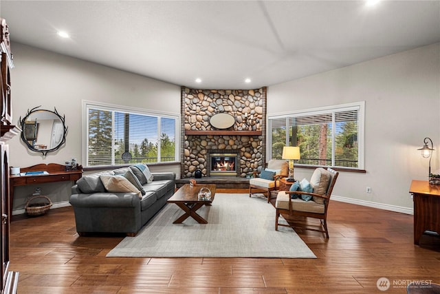 6753 Forest Ridge Dr, Wenatchee, WA 98801 - living area with a stone fireplace, plenty of natural light, recessed lighting, baseboards, and wood finished floors