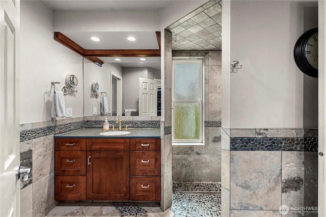 6753 Forest Ridge Dr, Wenatchee, WA 98801 - full bathroom with tile walls, walk in shower, vanity, a wainscoted wall, and recessed lighting