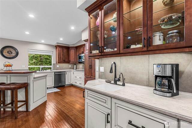 6753 Forest Ridge Dr, Wenatchee, WA 98801 - kitchen featuring a sink, dishwasher, light countertops, decorative backsplash, and vaulted ceiling
