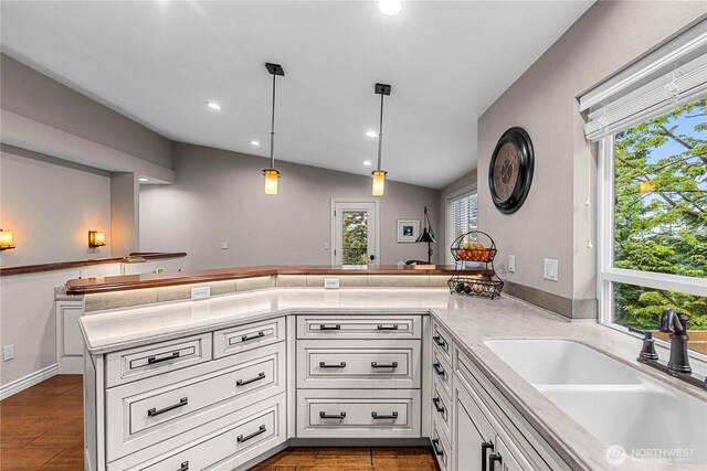 6753 Forest Ridge Dr, Wenatchee, WA 98801 - kitchen with a sink, white cabinets, light countertops, a peninsula, and recessed lighting