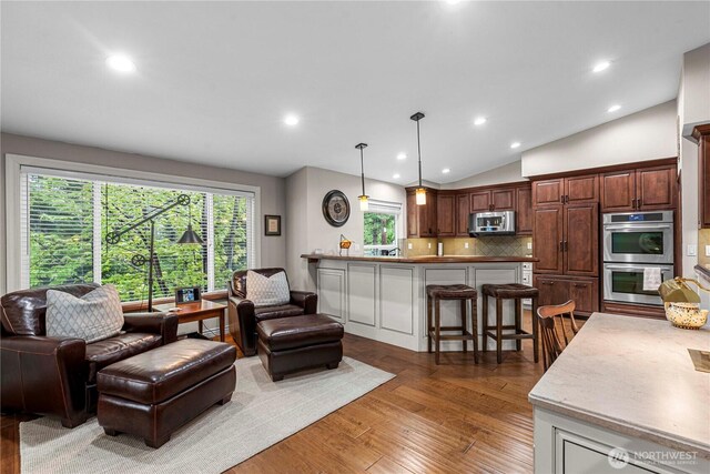 6753 Forest Ridge Dr, Wenatchee, WA 98801 - living area with light wood finished floors, lofted ceiling, and recessed lighting