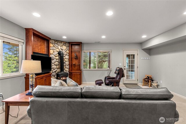 6753 Forest Ridge Dr, Wenatchee, WA 98801 - carpeted living room with baseboards, recessed lighting, and a wood stove