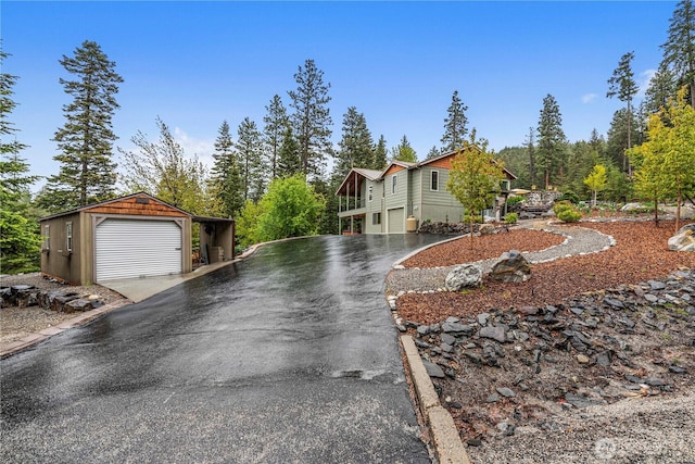 6753 Forest Ridge Dr, Wenatchee, WA 98801 - view of property exterior featuring a detached garage, an outbuilding, and driveway