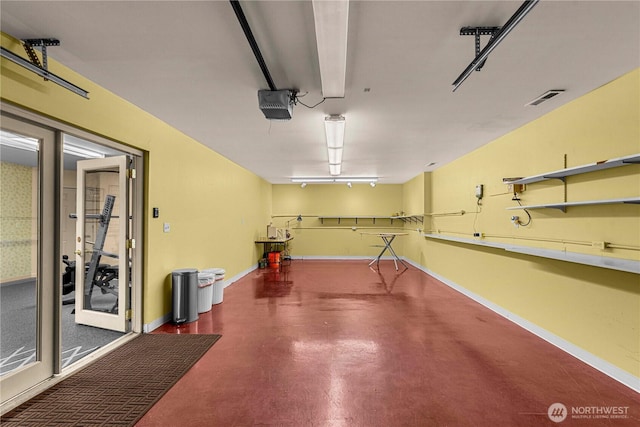 6753 Forest Ridge Dr, Wenatchee, WA 98801 - garage featuring a garage door opener and baseboards