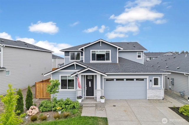 18230 134th Ave E, Puyallup, WA 98374 - view of front of house with concrete driveway, roof with shingles, and an attached garage