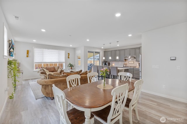 18230 134th Ave E, Puyallup, WA 98374 - dining room with light wood-style flooring, baseboards, and recessed lighting