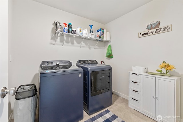 18230 134th Ave E, Puyallup, WA 98374 - laundry room with washing machine and clothes dryer, cabinet space, and light tile patterned floors