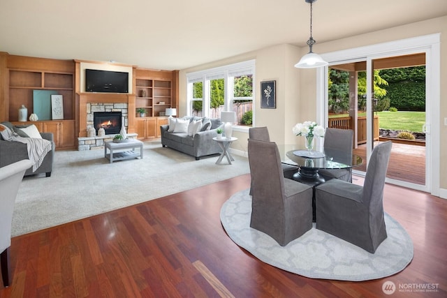 21515 26th St E, Lake Tapps, WA 98391 - dining area featuring plenty of natural light, a fireplace, and wood finished floors