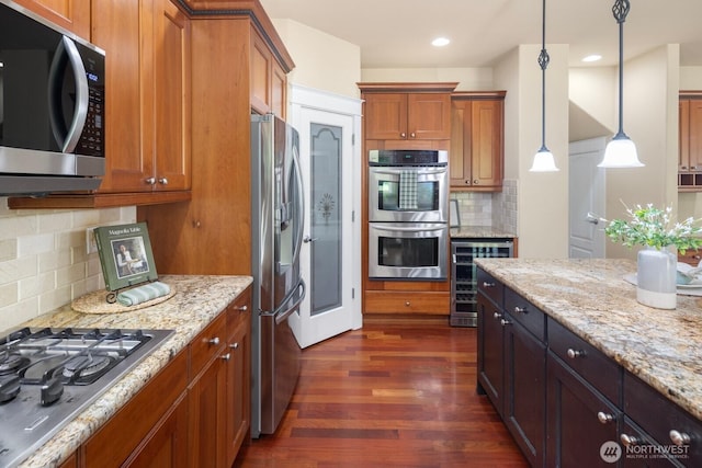 21515 26th St E, Lake Tapps, WA 98391 - kitchen with appliances with stainless steel finishes, dark wood-type flooring, wine cooler, brown cabinets, and backsplash
