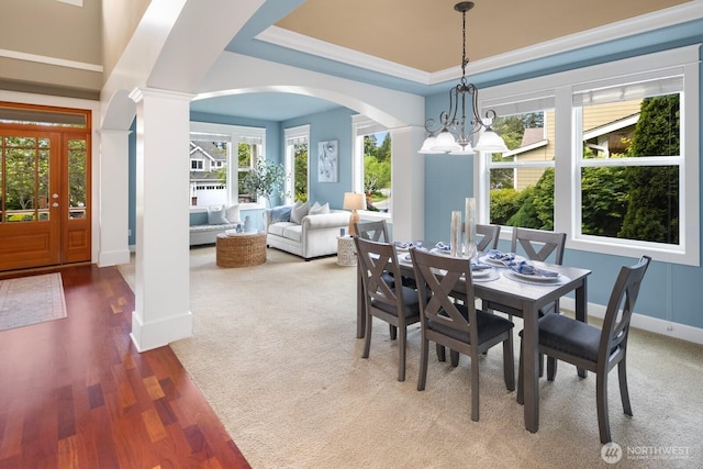 21515 26th St E, Lake Tapps, WA 98391 - dining room with a chandelier, arched walkways, ornate columns, plenty of natural light, and crown molding