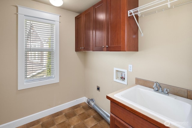 21515 26th St E, Lake Tapps, WA 98391 - laundry room with cabinet space, hookup for an electric dryer, hookup for a washing machine, and baseboards