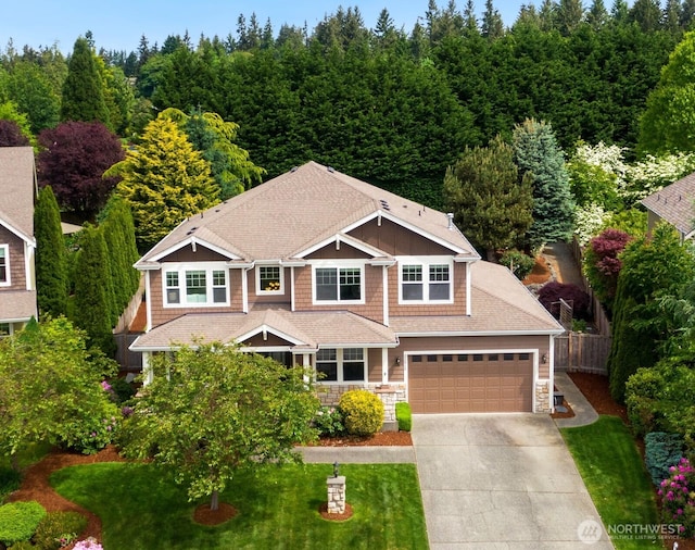 21515 26th St E, Lake Tapps, WA 98391 - view of front facade with concrete driveway and stone siding