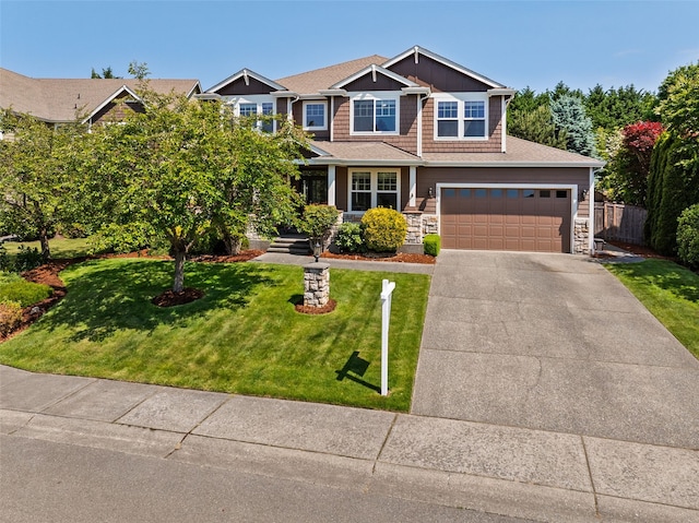 21515 26th St E, Lake Tapps, WA 98391 - craftsman house with concrete driveway, stone siding, and a garage