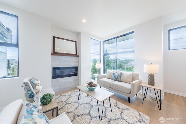 1019 Sturgus Ave S Unit A, Seattle, WA 98144 - living area featuring plenty of natural light, light wood-style flooring, a tile fireplace, and recessed lighting
