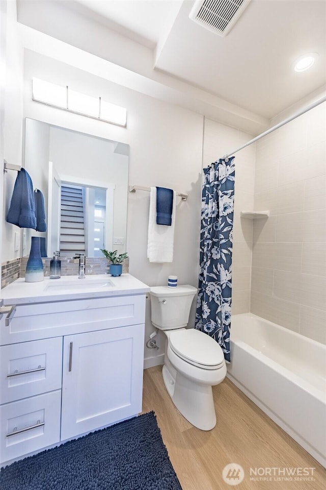 1019 Sturgus Ave S Unit A, Seattle, WA 98144 - full bathroom with toilet, wood finished floors, vanity, and shower / bath combo