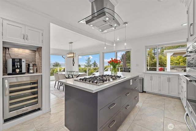 1505 E Horizon Dr, Mukilteo, WA 98275 - kitchen with wine cooler, appliances with stainless steel finishes, backsplash, light countertops, and plenty of natural light
