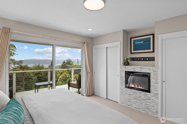 1505 E Horizon Dr, Mukilteo, WA 98275 - bedroom featuring a glass covered fireplace, carpet floors, baseboards, and recessed lighting