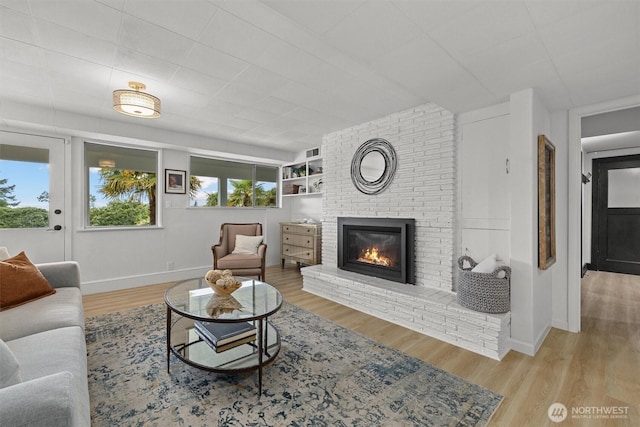 1505 E Horizon Dr, Mukilteo, WA 98275 - living area with wood finished floors, a fireplace, and baseboards