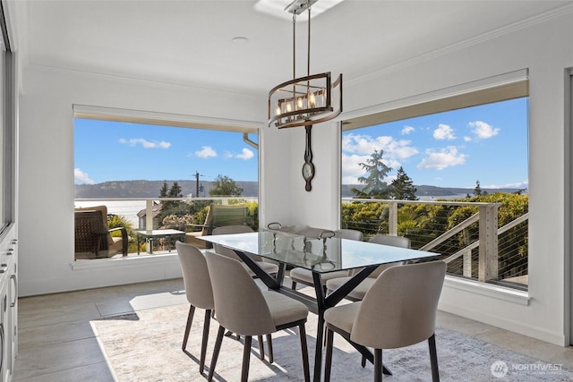 1505 E Horizon Dr, Mukilteo, WA 98275 - dining space with a mountain view, ornamental molding, and a chandelier
