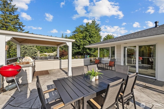 1505 E Horizon Dr, Mukilteo, WA 98275 - view of patio / terrace with outdoor dining area and an outdoor kitchen