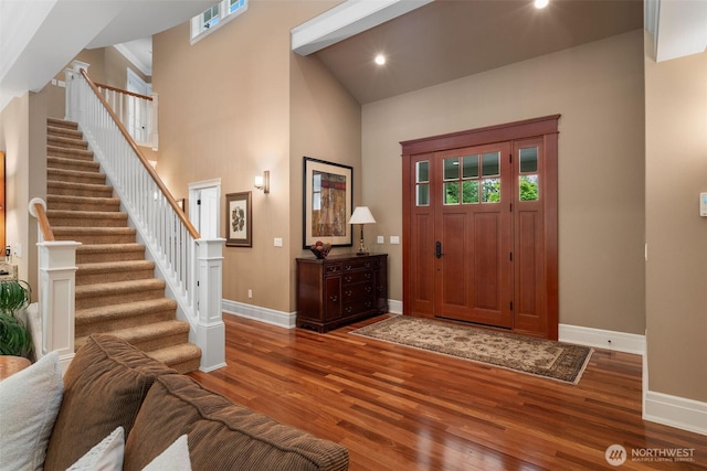 2920 39th Ln NW, Olympia, WA 98502 - foyer entrance featuring baseboards, wood finished floors, stairs, a towering ceiling, and recessed lighting