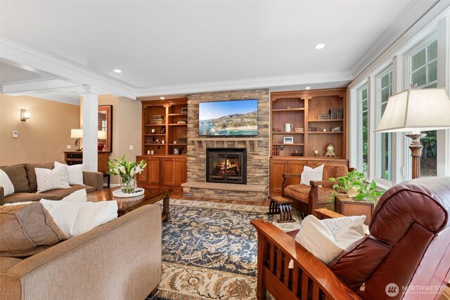 2920 39th Ln NW, Olympia, WA 98502 - living room featuring crown molding, recessed lighting, a fireplace, decorative columns, and built in shelves