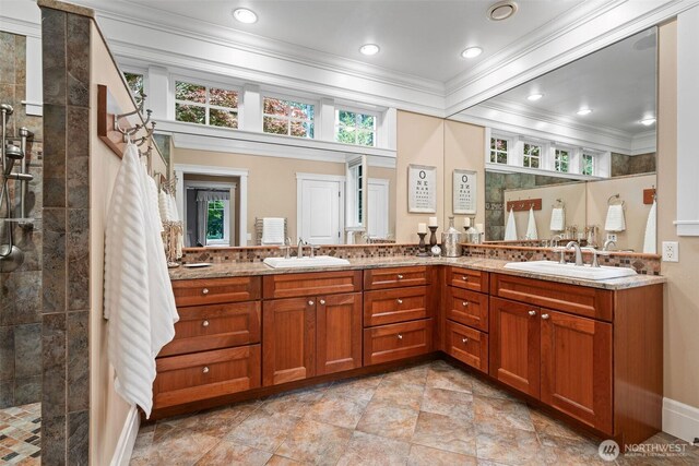 2920 39th Ln NW, Olympia, WA 98502 - full bathroom featuring ornamental molding, double vanity, walk in shower, recessed lighting, and baseboards