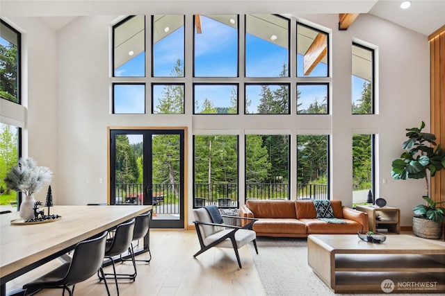 400 Hyak Dr E, Snoqualmie Pass, WA 98068 - living area with a towering ceiling, light wood-style flooring, recessed lighting, and beam ceiling