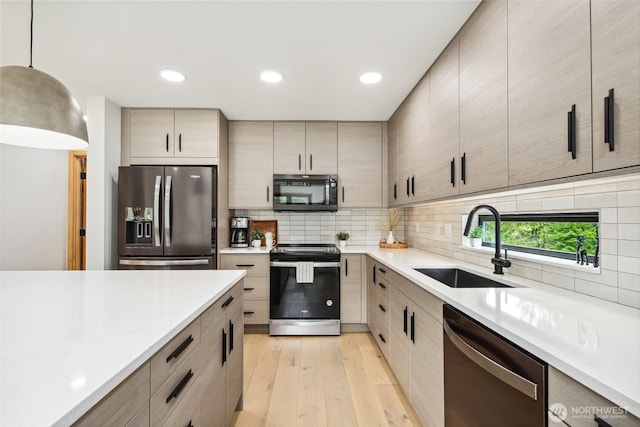 400 Hyak Dr E, Snoqualmie Pass, WA 98068 - kitchen featuring stainless steel appliances, a sink, light countertops, light wood-style floors, and recessed lighting