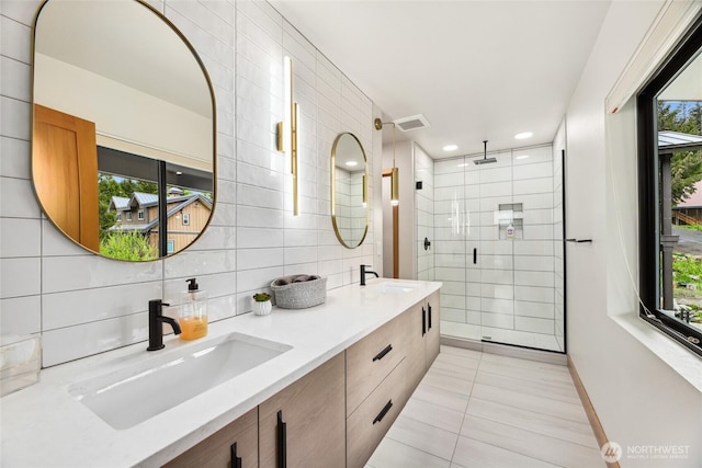 400 Hyak Dr E, Snoqualmie Pass, WA 98068 - full bathroom featuring tile patterned flooring, a stall shower, tasteful backsplash, tile walls, and double vanity