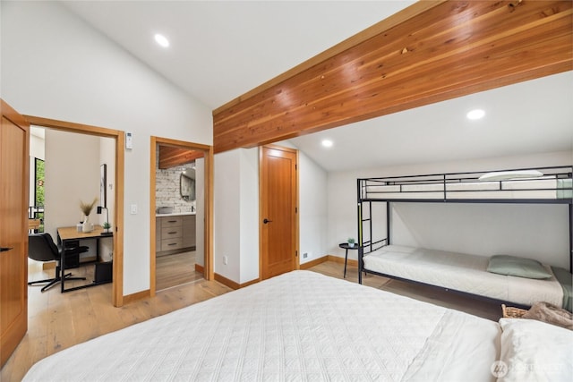 400 Hyak Dr E, Snoqualmie Pass, WA 98068 - bedroom featuring vaulted ceiling, wood finished floors, a desk, recessed lighting, and baseboards