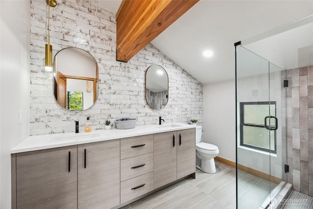 400 Hyak Dr E, Snoqualmie Pass, WA 98068 - full bathroom featuring a stall shower, lofted ceiling, double vanity, and toilet
