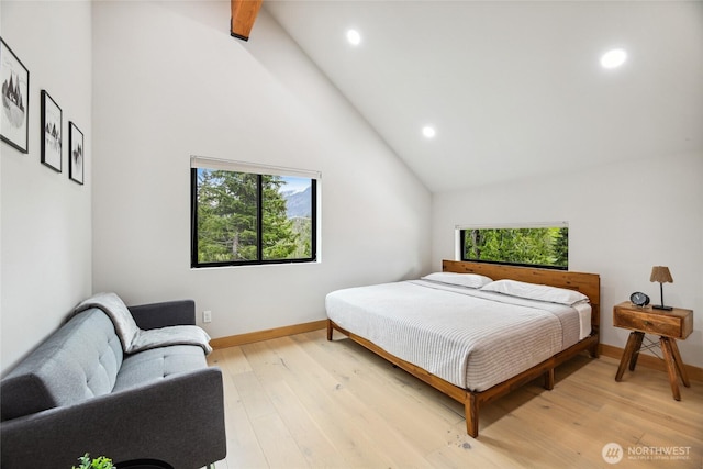 400 Hyak Dr E, Snoqualmie Pass, WA 98068 - bedroom featuring recessed lighting, high vaulted ceiling, baseboards, light wood-style floors, and beam ceiling