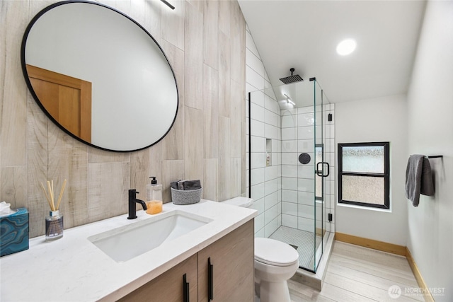 400 Hyak Dr E, Snoqualmie Pass, WA 98068 - bathroom featuring a shower stall, vanity, wood finished floors, toilet, and baseboards