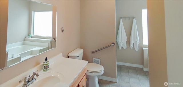 620 112th St SE Unit 153, Everett, WA 98208 - full bathroom with toilet, tile patterned floors, vanity, and baseboards