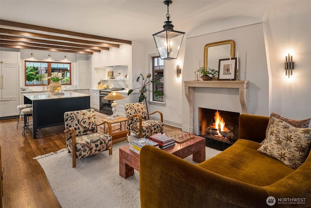 4332 NE 43rd St, Seattle, WA 98105 - living room featuring dark wood-style floors, a fireplace with flush hearth, and beamed ceiling