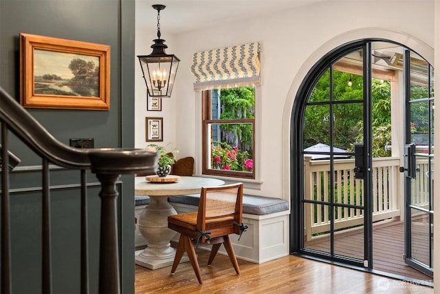 4332 NE 43rd St, Seattle, WA 98105 - doorway featuring wood finished floors, a chandelier, and arched walkways