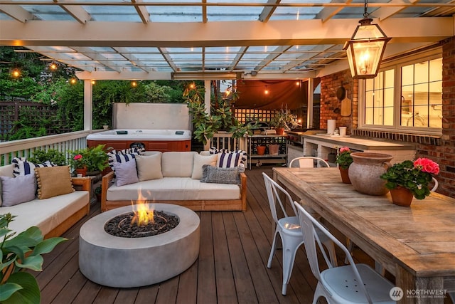 4332 NE 43rd St, Seattle, WA 98105 - wooden deck with a hot tub, outdoor dining area, and an outdoor living space with a fire pit
