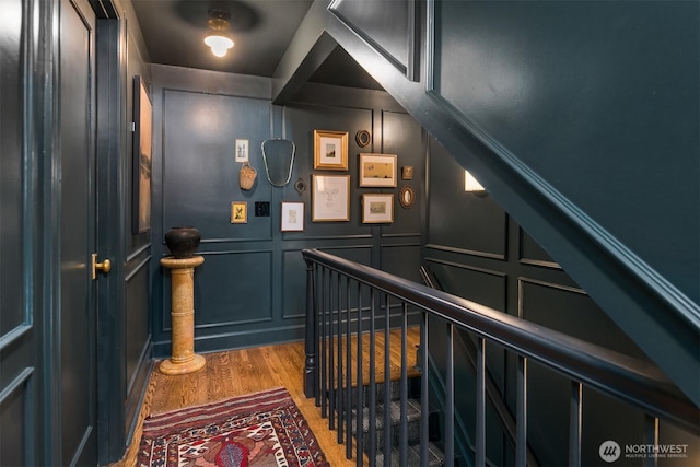 4332 NE 43rd St, Seattle, WA 98105 - stairway featuring wood finished floors and a decorative wall