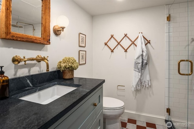 4332 NE 43rd St, Seattle, WA 98105 - bathroom featuring toilet, vanity, a shower stall, tile patterned floors, and baseboards