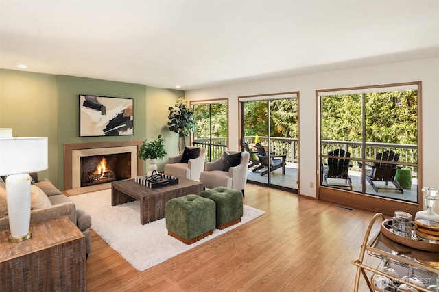 6160 W Mercer Way, Mercer Island, WA 98040 - living room featuring wood finished floors, a lit fireplace, and recessed lighting
